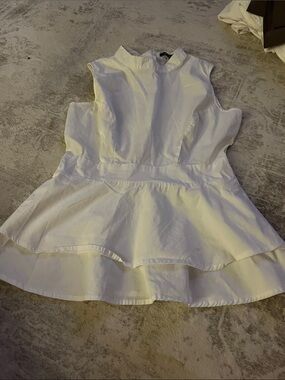 White Sleeveless Peplum Top